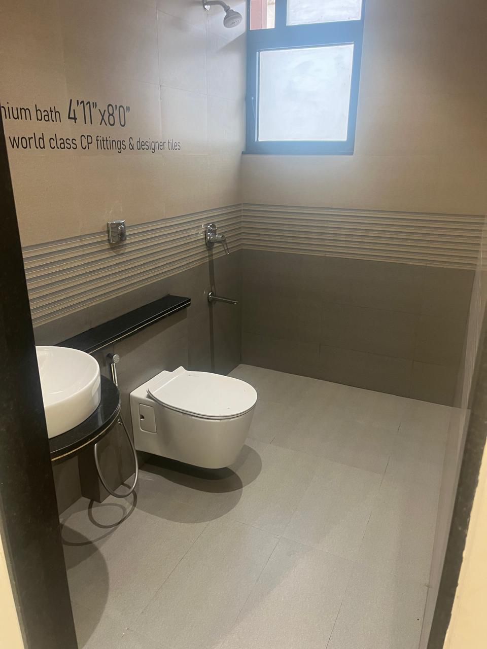 Western Toilet By SG GROUP with Beige Tiles
